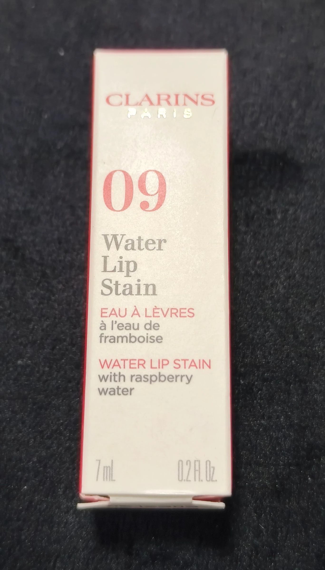Neceser com batom da Clarins e cremes. – photo 5